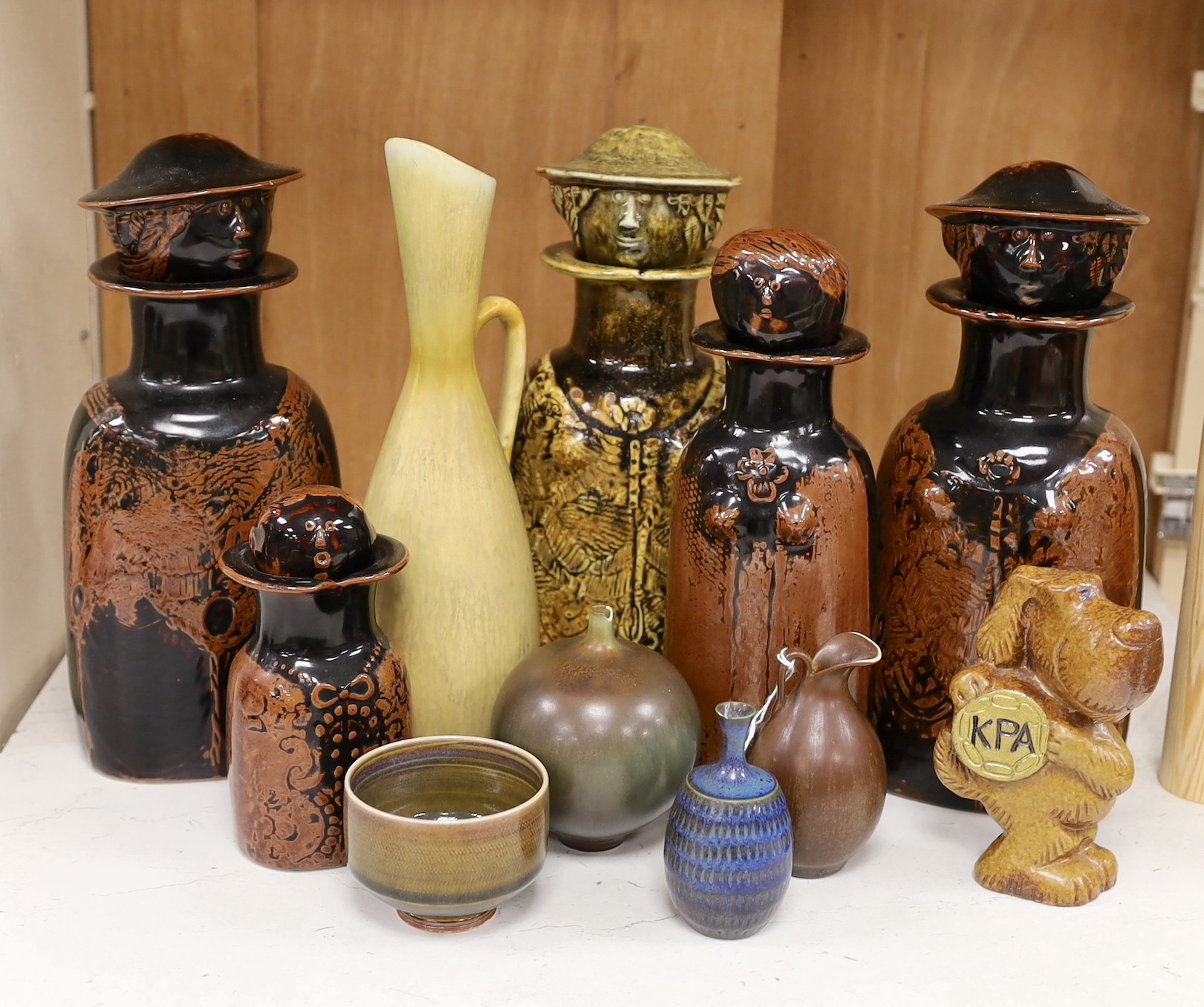 Five Gustavsberg Stig Lindberg figural bottles, together with other Scandinavian pottery sundries, tallest 27cm, (11)